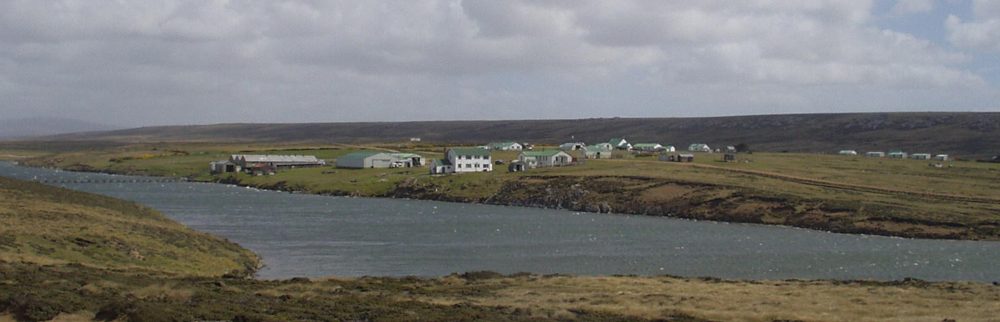 Fitzroy, East Falklands
Fitzroy is named for Captain Fitzroy of the Beagle (1833) and lies south-west of Stanley on the river Fitzroy which rises from a lake on the east side of Mount Wickham. The river divides Fitzroy North and Fitzroy South. It is owned by Falkland Land Holdings and covers 27,265 ha. In 2018 Fitzroy had a population of 8 and 18 dogs, 57 cattle and 18,590 fine wool sheep.